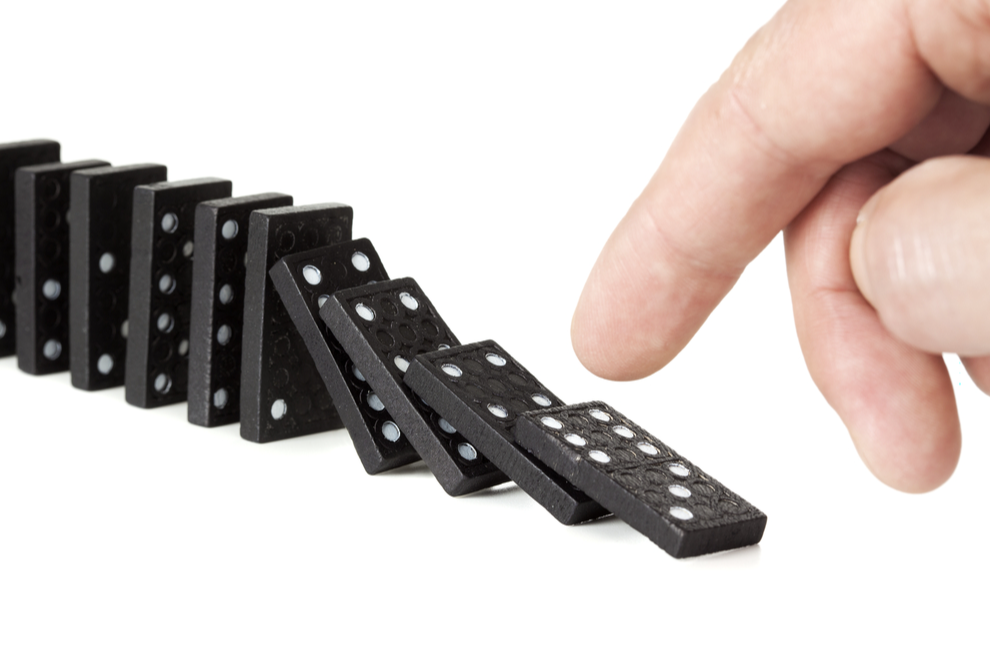 First domino tipping over a much larger chain of dominoes